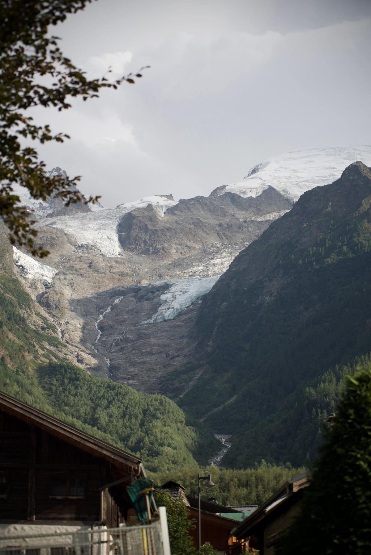Snow covered Mont Blanc above Chamonix, with wooden chalets in the foreground